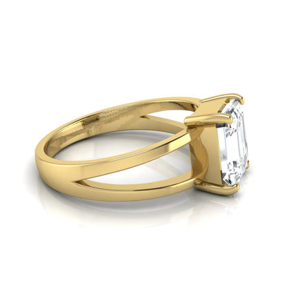 Emerald cut lab grown diamond split shank engagement ring featuring a classic four-prong setting and polished yellow gold style band.