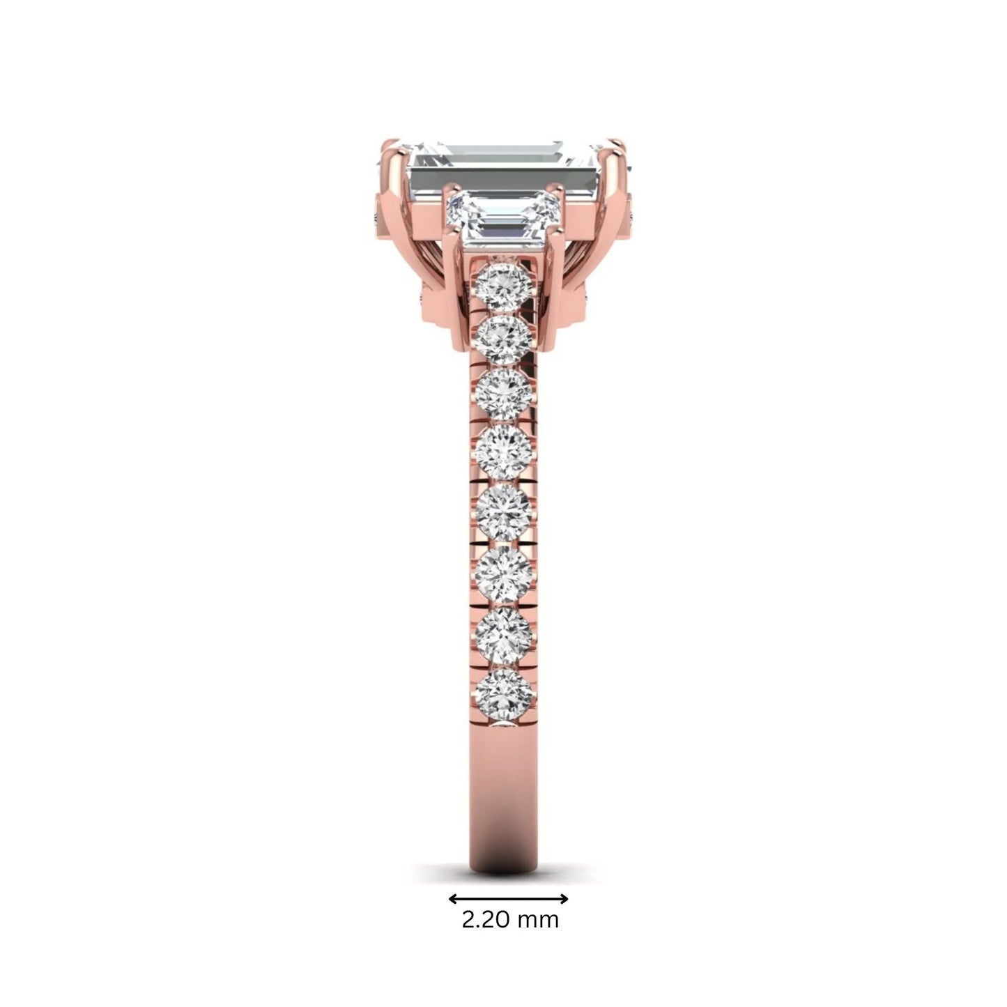 Emerald cut three stone lab grown diamond engagement ring in rose gold featuring a 2.62 carat IGI certified center diamond with emerald cut side stones and pavé band.