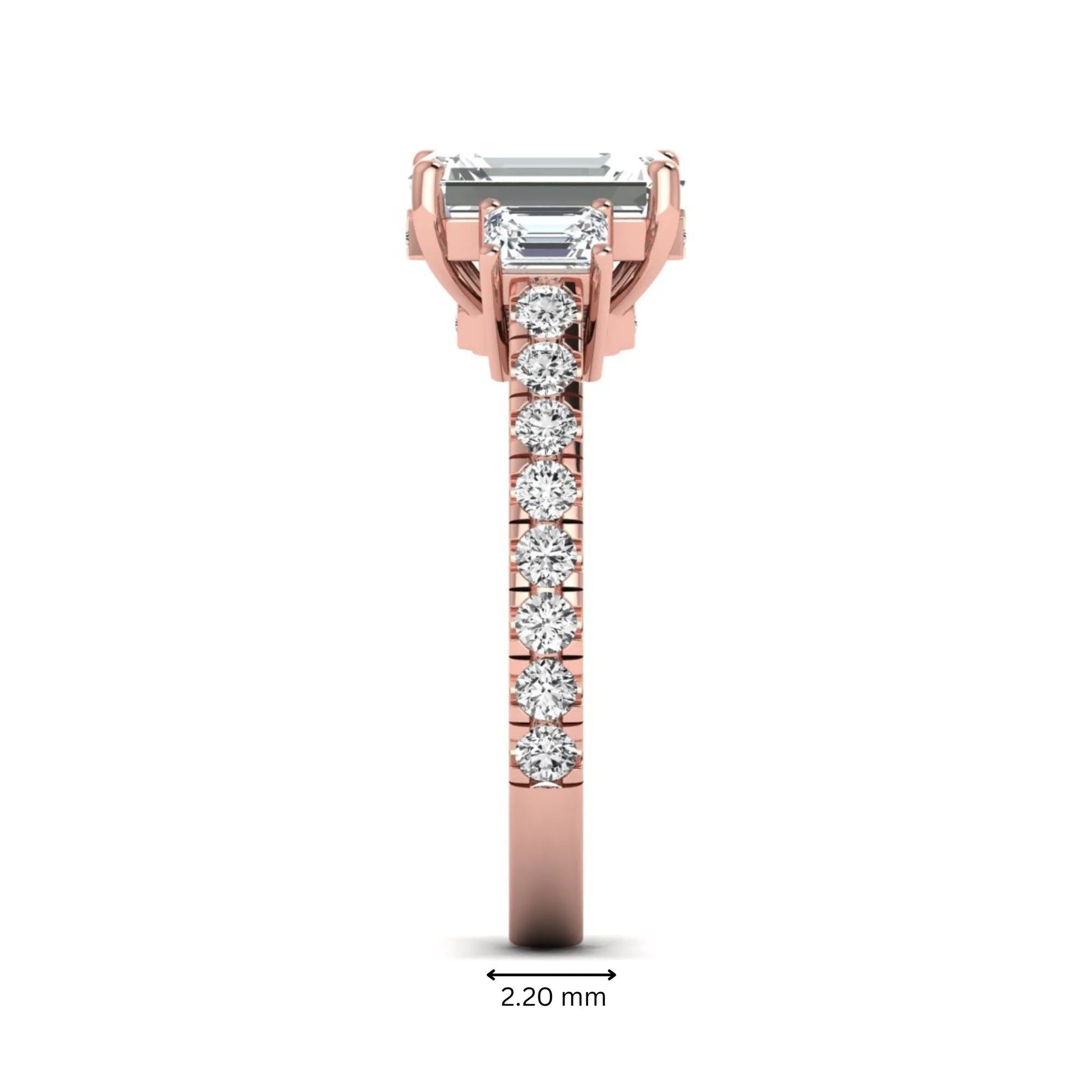 Emerald cut three stone lab grown diamond engagement ring in rose gold featuring a 2.62 carat IGI certified center diamond with emerald cut side stones and pavé band.