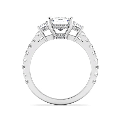 Emerald cut three stone lab grown diamond engagement ring in white gold featuring a 2.62 carat IGI certified center diamond with emerald cut side stones and pavé band.