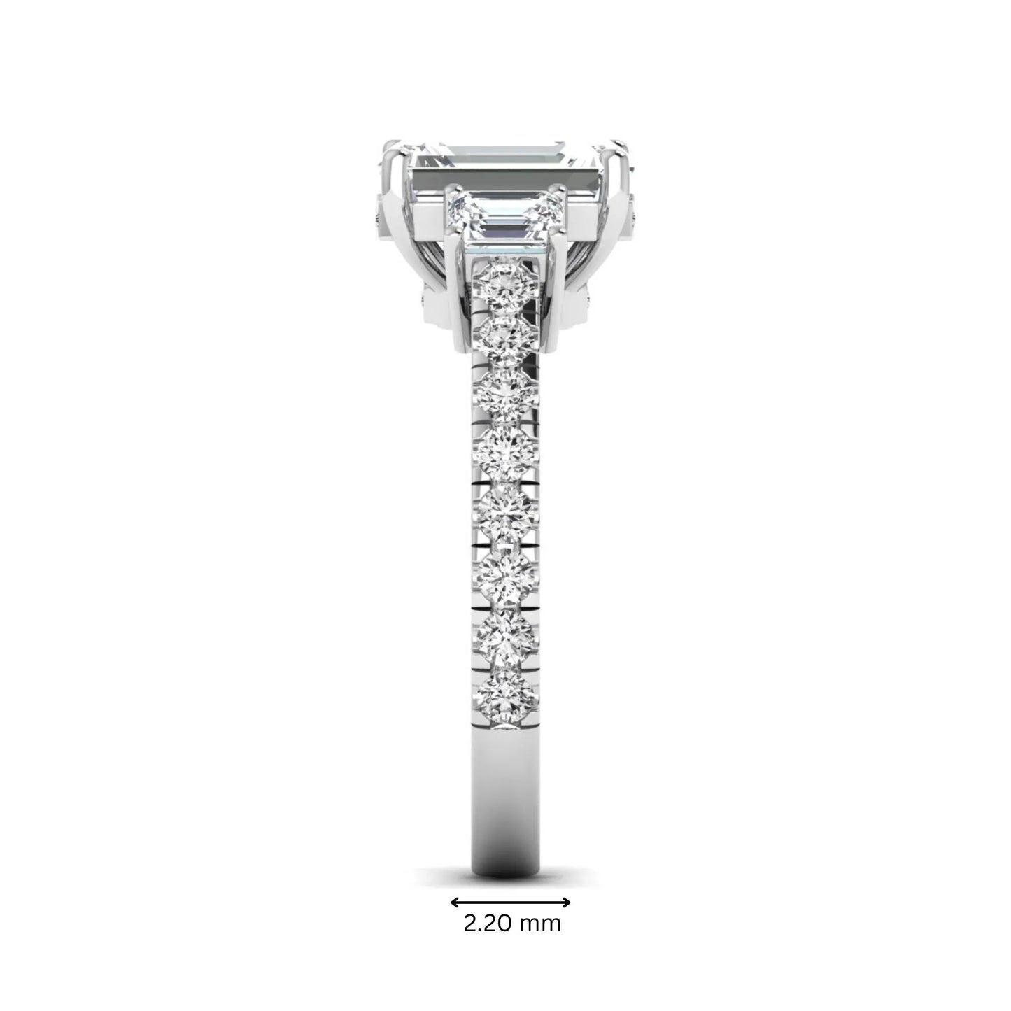 Emerald cut three stone lab grown diamond engagement ring in white gold featuring a 2.62 carat IGI certified center diamond with emerald cut side stones and pavé band.
