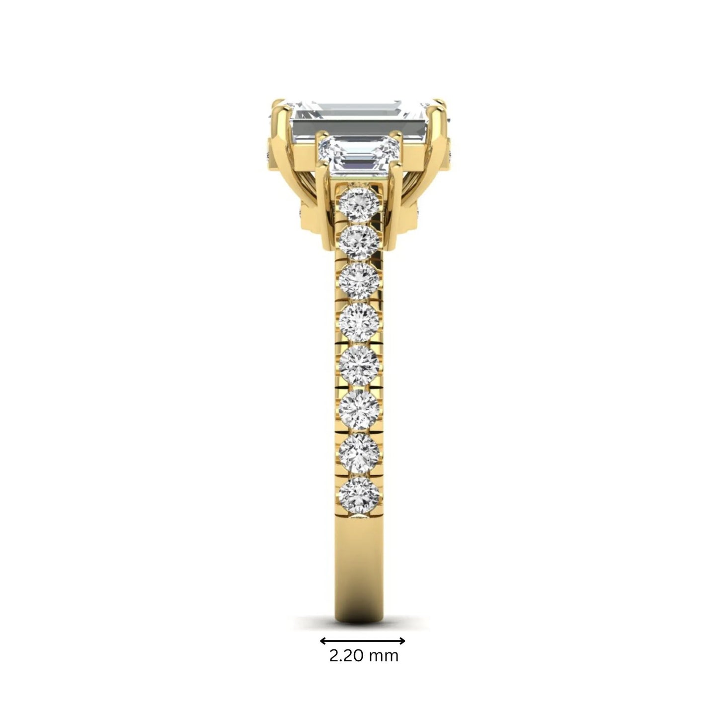 Emerald cut three stone lab grown diamond engagement ring in yellow gold featuring a 2.62 carat IGI certified center diamond with emerald cut side stones and pavé band.