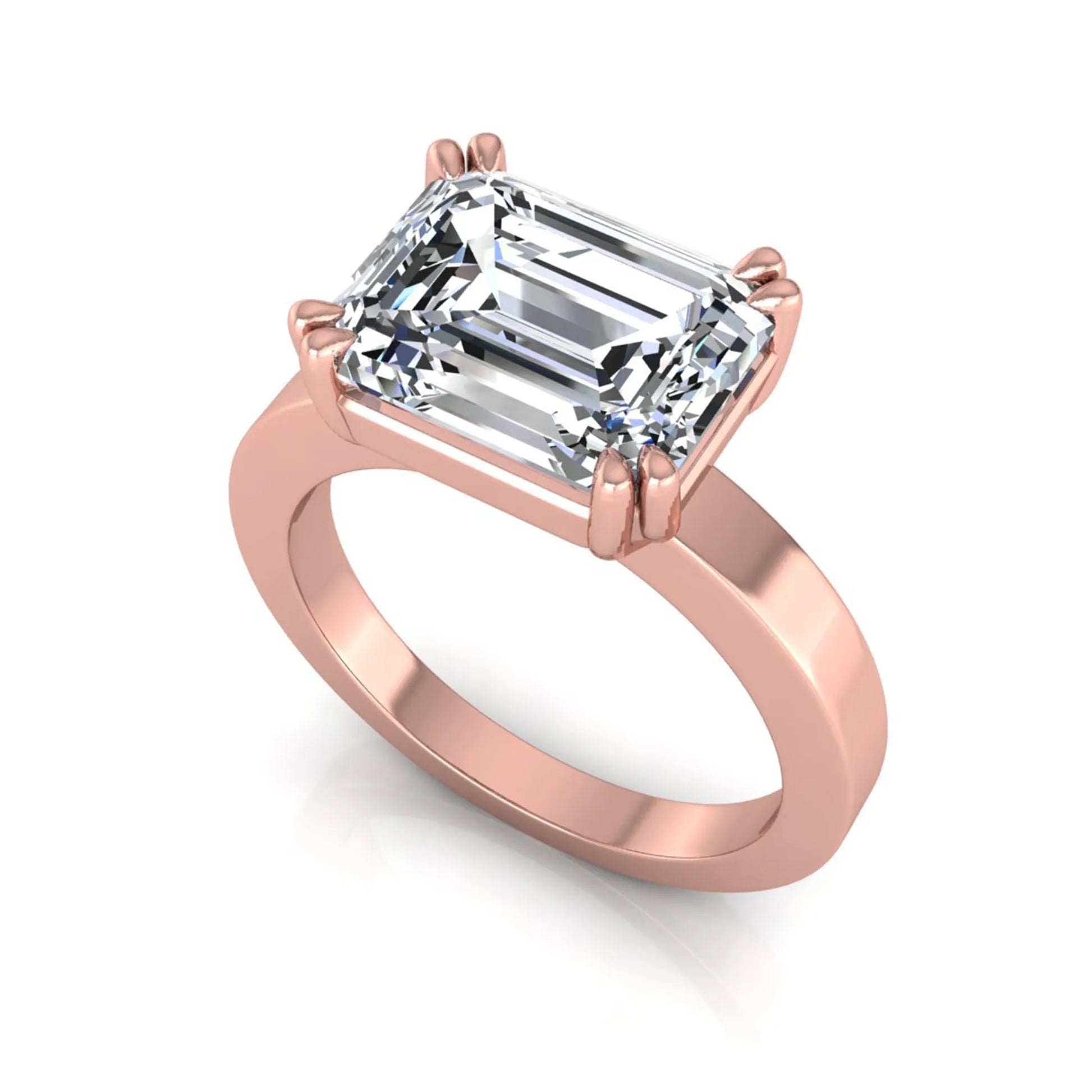 Emerald cut lab grown diamond solitaire engagement ring featuring a 3.79 carat IGI certified center diamond in a double claw prong setting with a rose gold band.