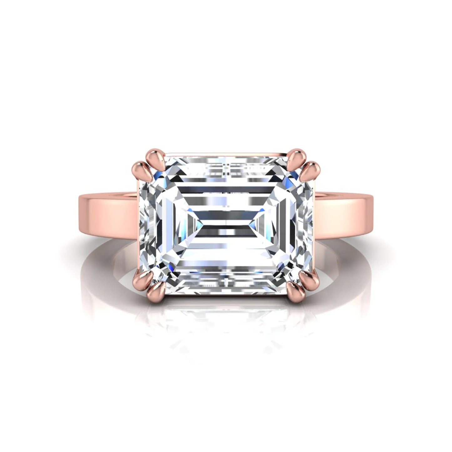 Emerald cut lab grown diamond solitaire engagement ring featuring a 3.79 carat IGI certified center diamond in a double claw prong setting with a rose gold band.