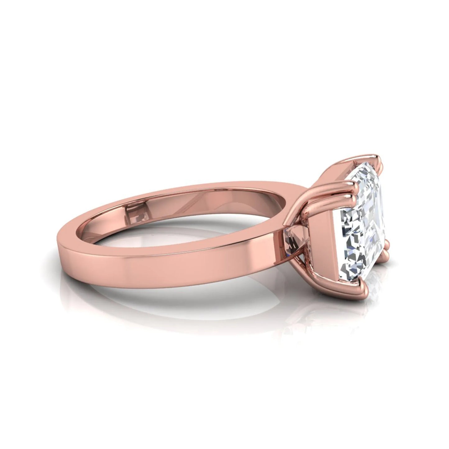 Emerald cut lab grown diamond solitaire engagement ring featuring a 3.79 carat IGI certified center diamond in a double claw prong setting with a rose gold band.