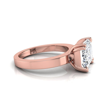 Emerald cut lab grown diamond solitaire engagement ring featuring a 3.79 carat IGI certified center diamond in a double claw prong setting with a rose gold band.