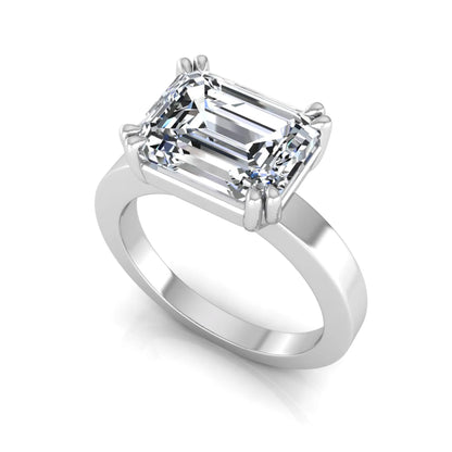 Emerald cut lab grown diamond solitaire engagement ring featuring a 3.79 carat IGI certified center diamond in a double claw prong setting with a white gold band.