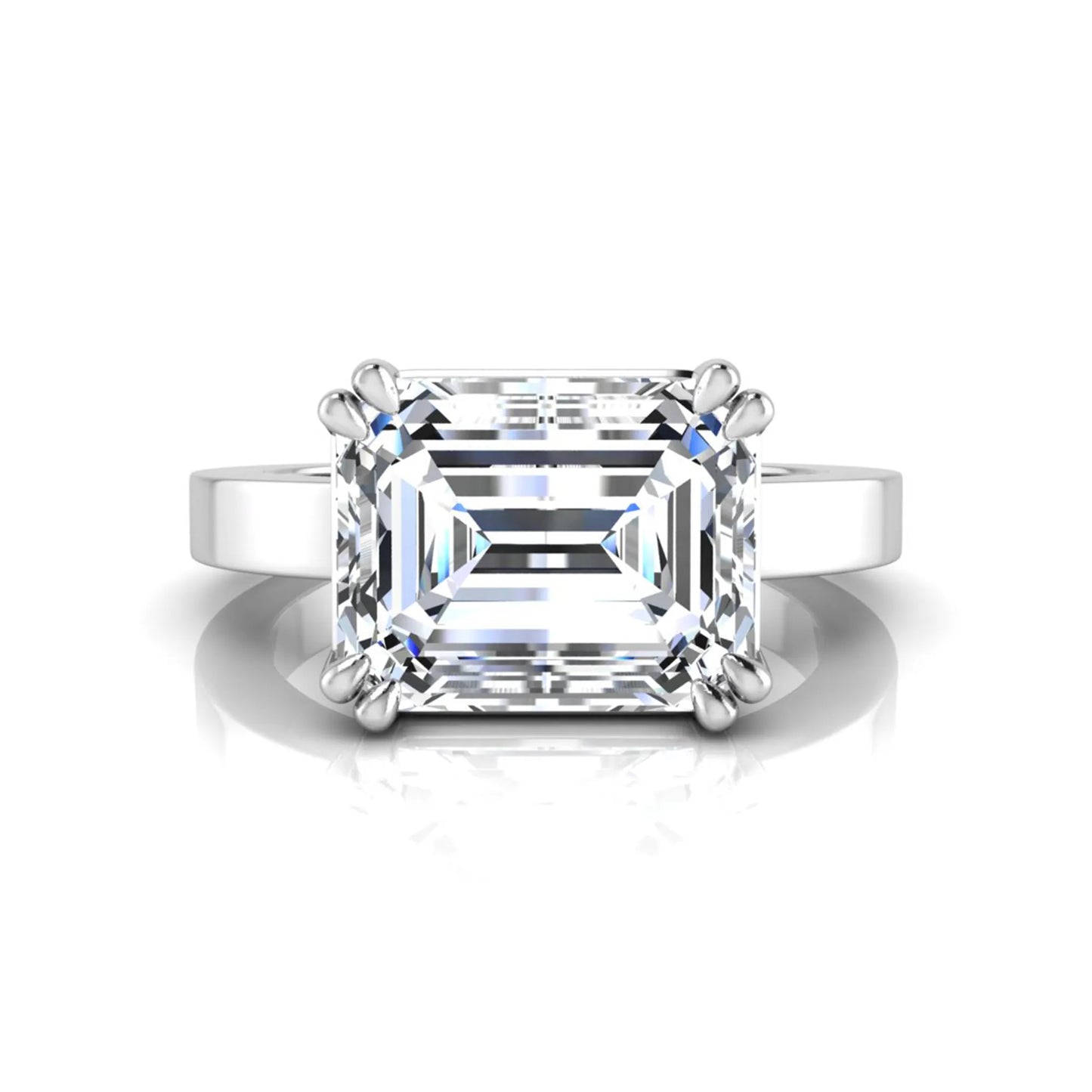 Emerald cut lab grown diamond solitaire engagement ring featuring a 3.79 carat IGI certified center diamond in a double claw prong setting with a white gold band.