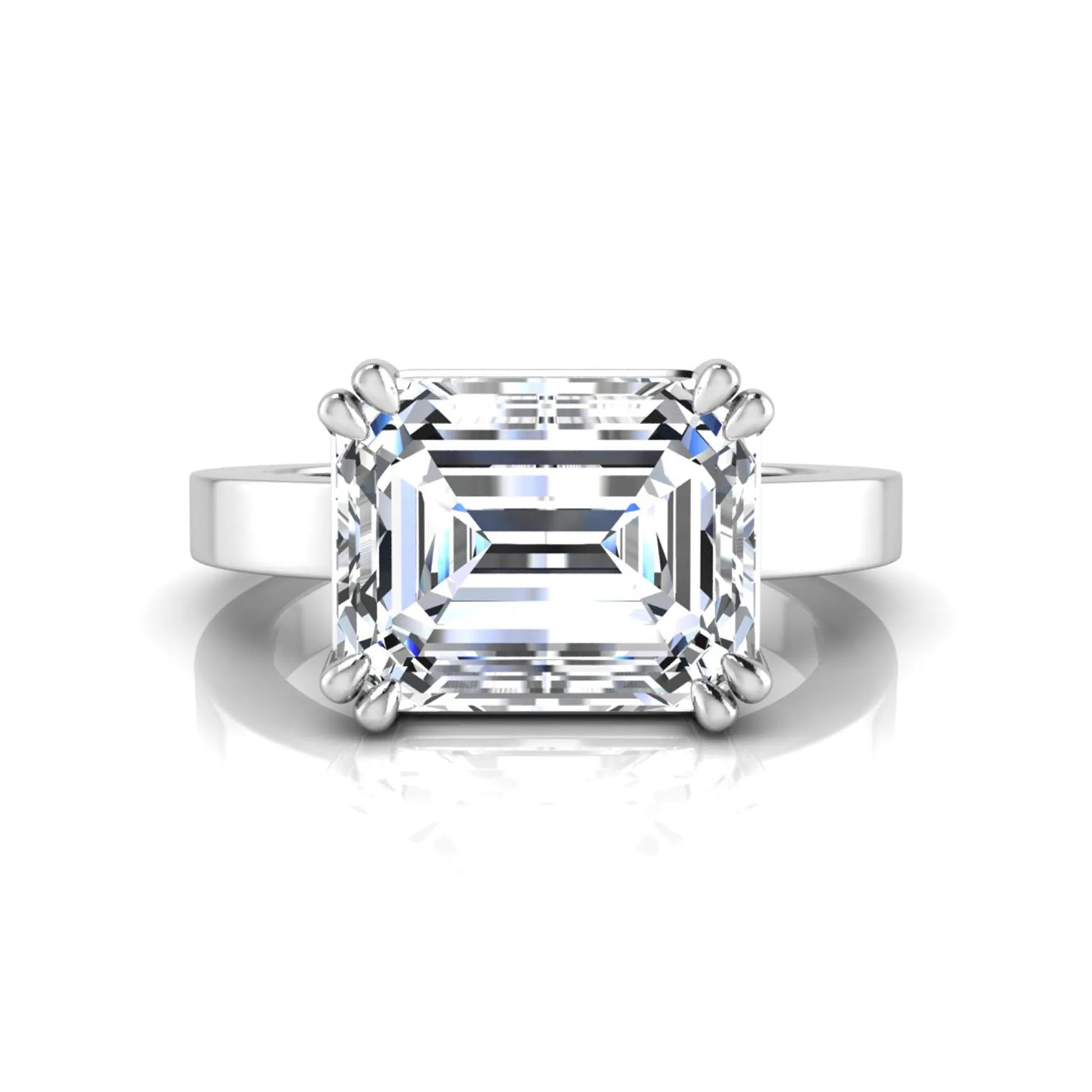 Emerald cut lab grown diamond solitaire engagement ring featuring a 3.79 carat IGI certified center diamond in a double claw prong setting with a white gold band.
