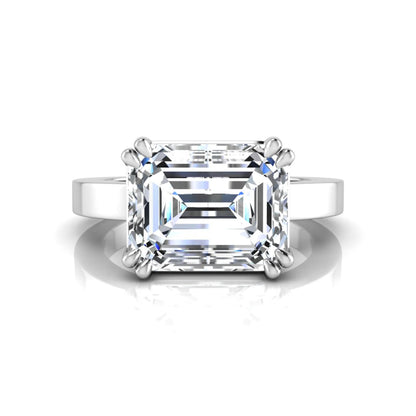 Emerald cut lab grown diamond solitaire engagement ring featuring a 3.79 carat IGI certified center diamond in a double claw prong setting with a white gold band.