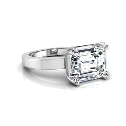 Emerald cut lab grown diamond solitaire engagement ring featuring a 3.79 carat IGI certified center diamond in a double claw prong setting with a white gold band.