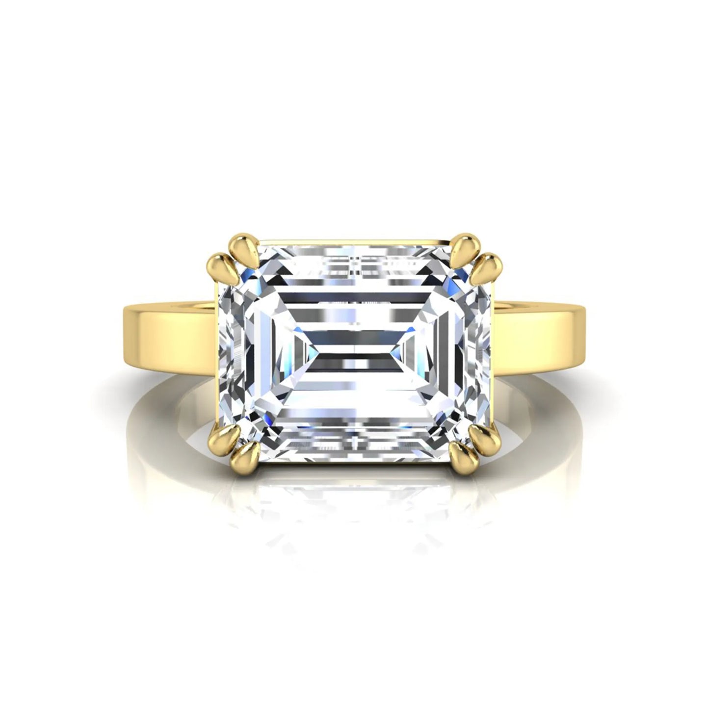 Emerald cut lab grown diamond solitaire engagement ring featuring a 3.79 carat IGI certified center diamond in a double claw prong setting with a yellow gold band.