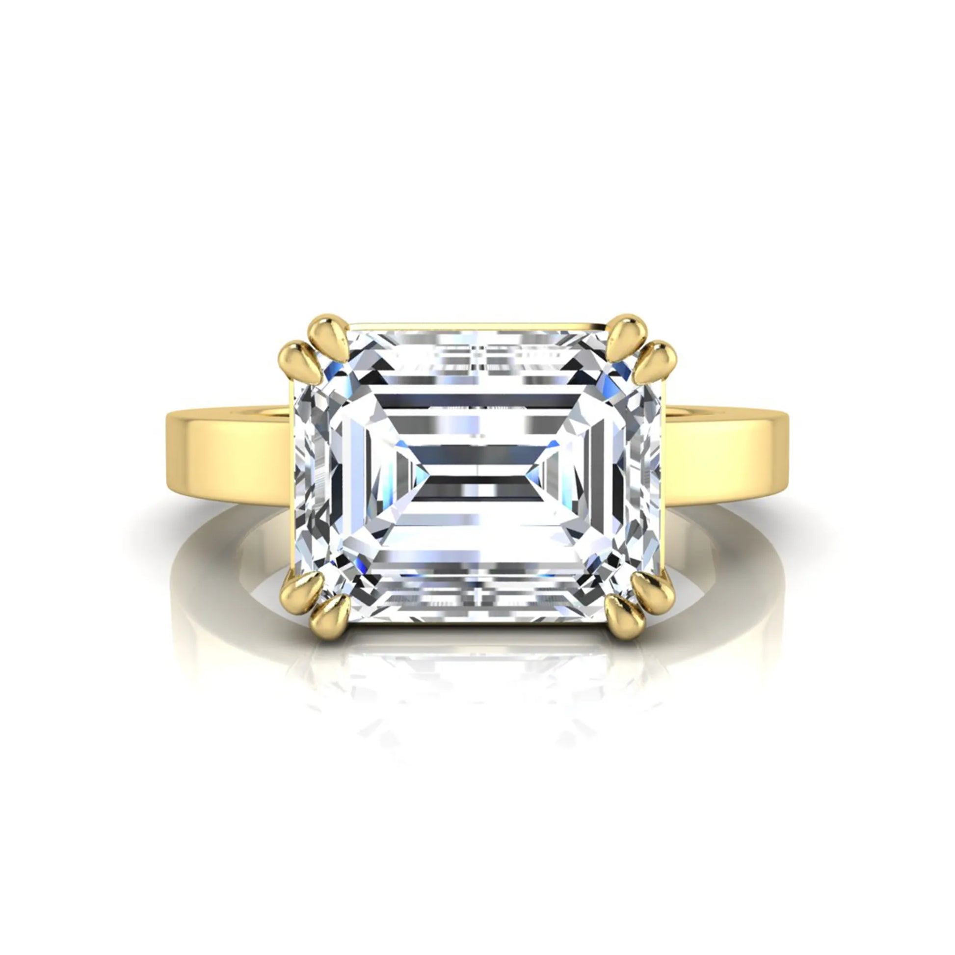 Emerald cut lab grown diamond solitaire engagement ring featuring a 3.79 carat IGI certified center diamond in a double claw prong setting with a yellow gold band.