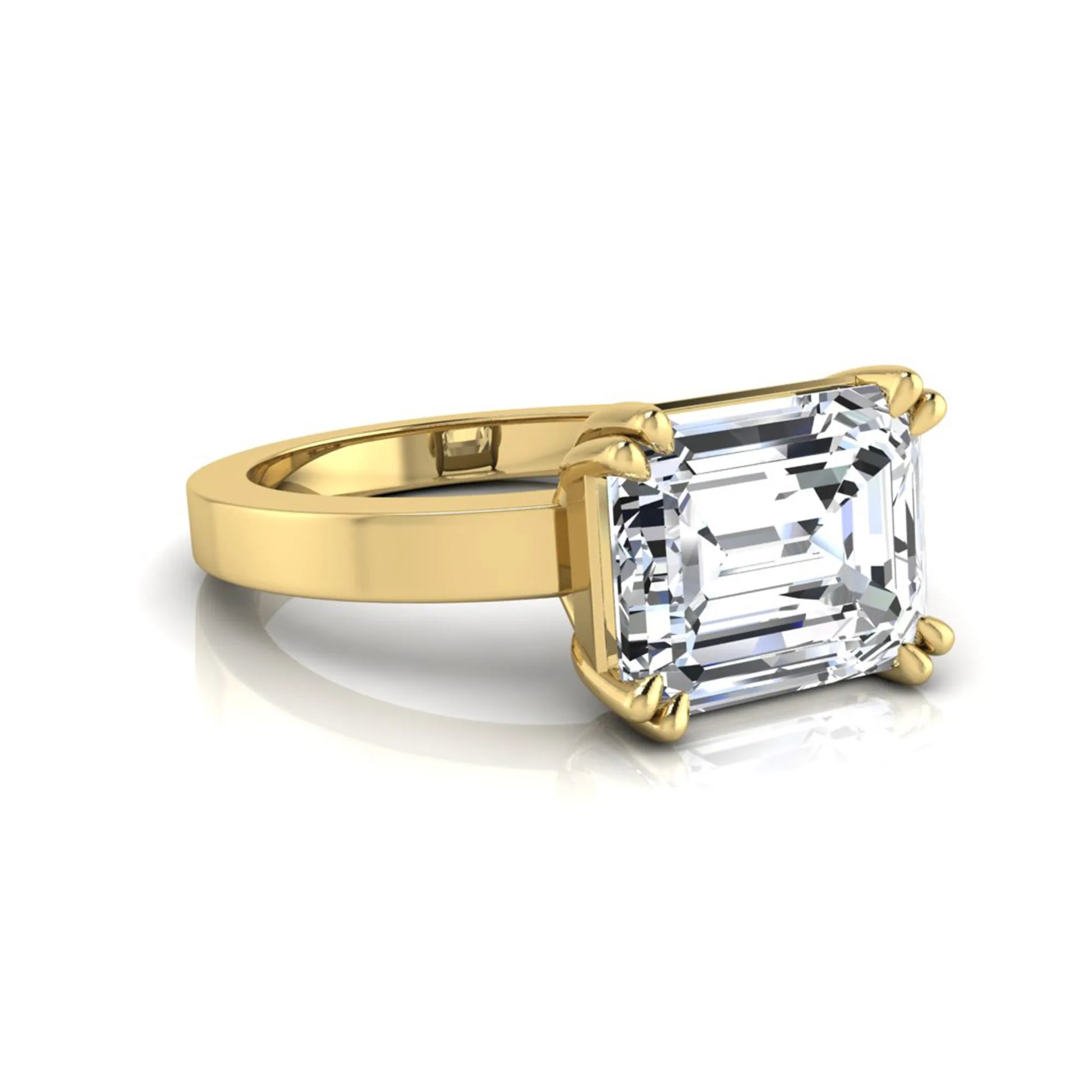 Emerald cut lab grown diamond solitaire engagement ring featuring a 3.79 carat IGI certified center diamond in a double claw prong setting with a yellow gold band.
