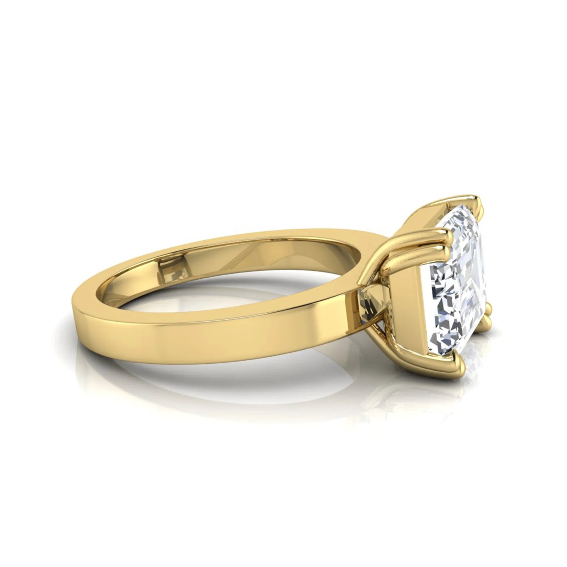 Emerald cut lab grown diamond solitaire engagement ring featuring a 3.79 carat IGI certified center diamond in a double claw prong setting with a yellow gold band.