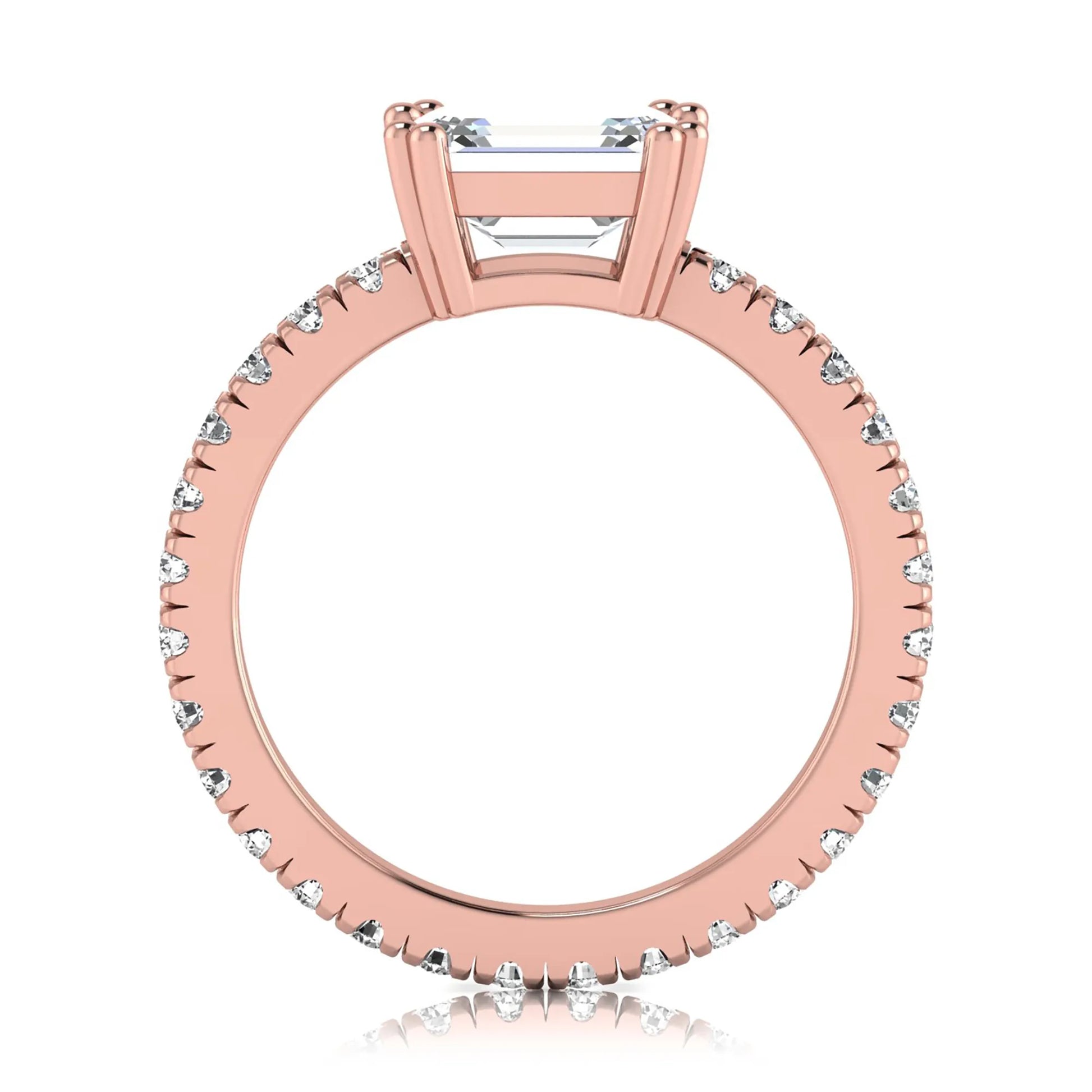 Emerald cut lab grown diamond side stone engagement ring featuring a four-prong setting with round accent diamonds in a rose gold tone design.