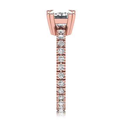 Emerald cut lab grown diamond side stone engagement ring featuring a four-prong setting with round accent diamonds in a rose gold tone design.