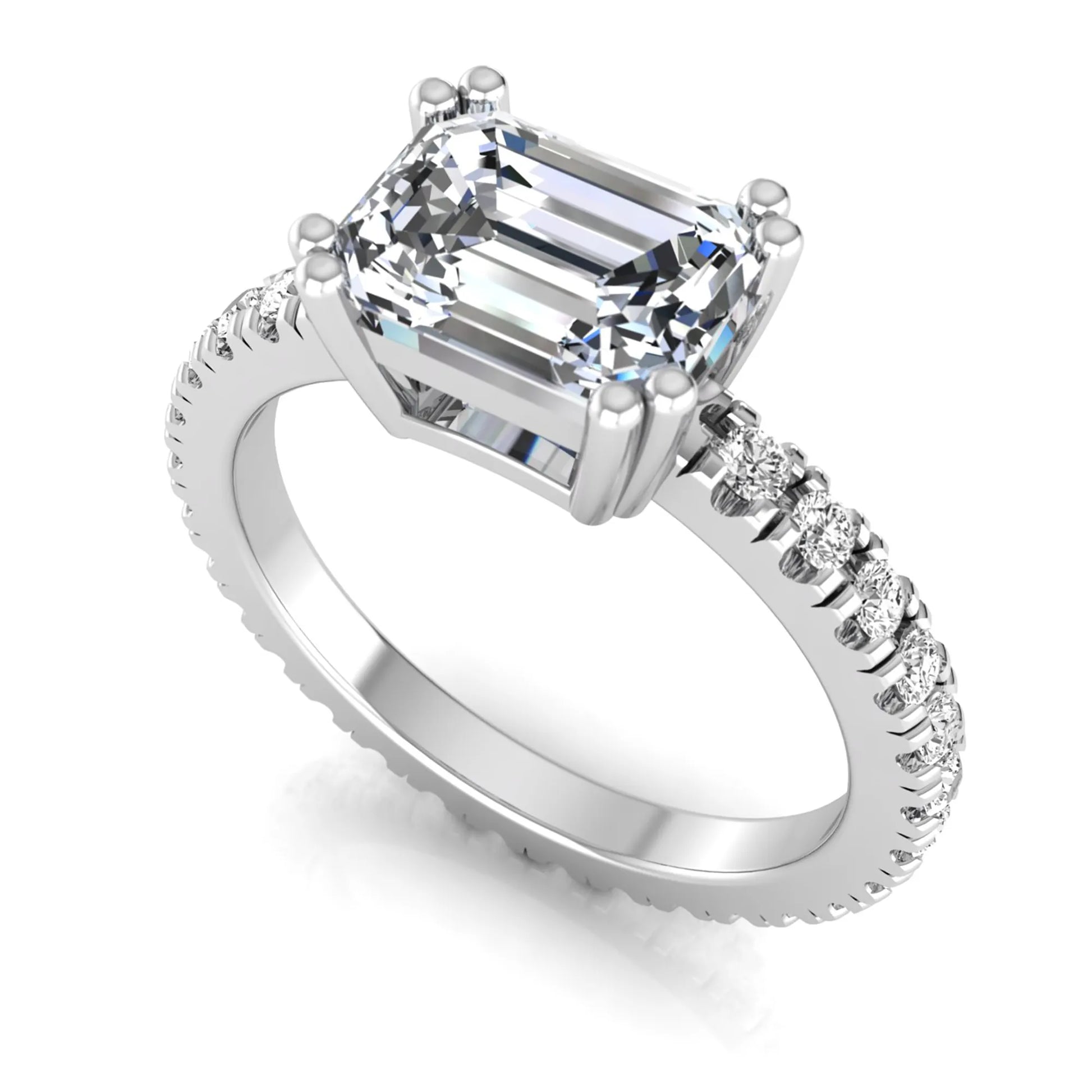 Emerald cut lab grown diamond side stone engagement ring featuring a four-prong setting with round accent diamonds in a white gold tone design.