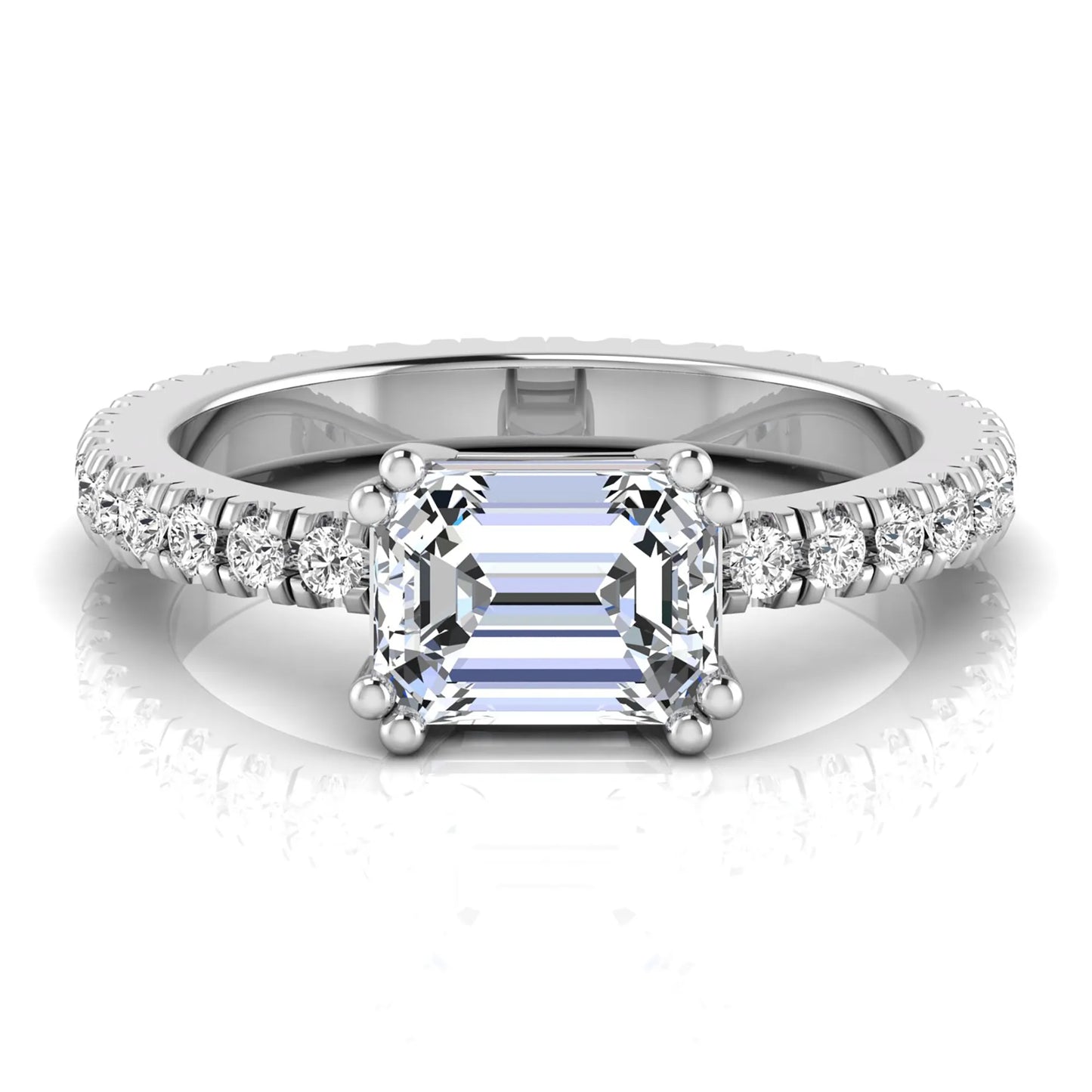 Emerald cut lab grown diamond side stone engagement ring featuring a four-prong setting with round accent diamonds in a white gold tone design.