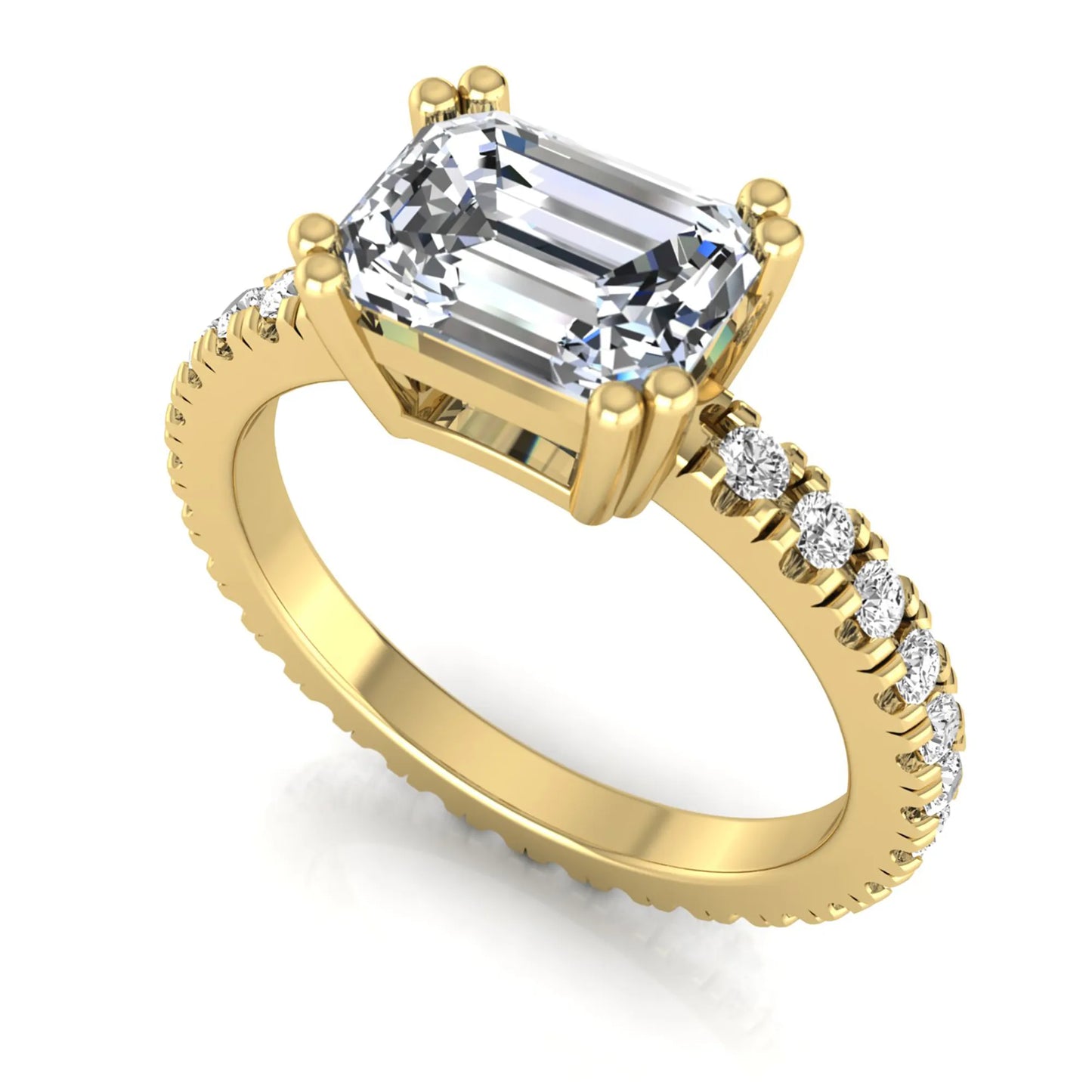 Emerald cut lab grown diamond side stone engagement ring featuring a four-prong setting with round accent diamonds in a yellow gold tone design.