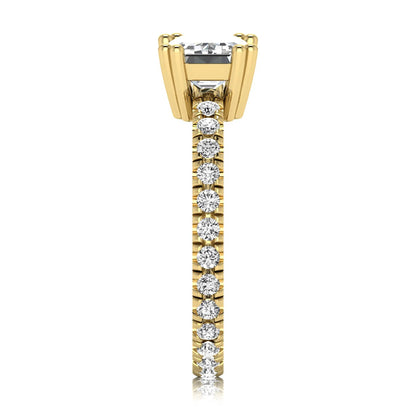 Emerald cut lab grown diamond side stone engagement ring featuring a four-prong setting with round accent diamonds in a yellow gold tone design.