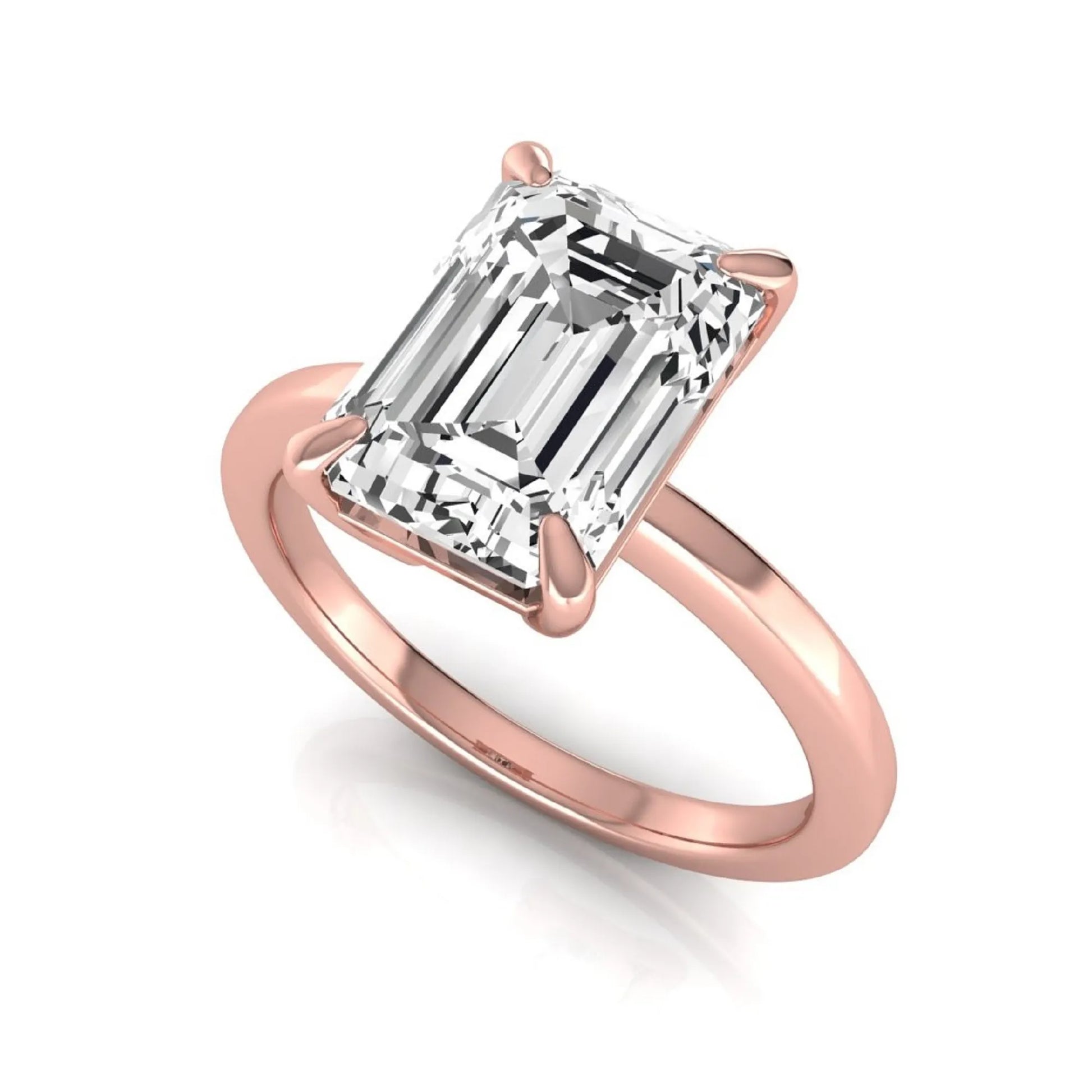 Emerald cut lab grown diamond solitaire engagement ring with a four prong setting in a rose gold tone, featuring an IGI certified 3.01 carat center diamond.