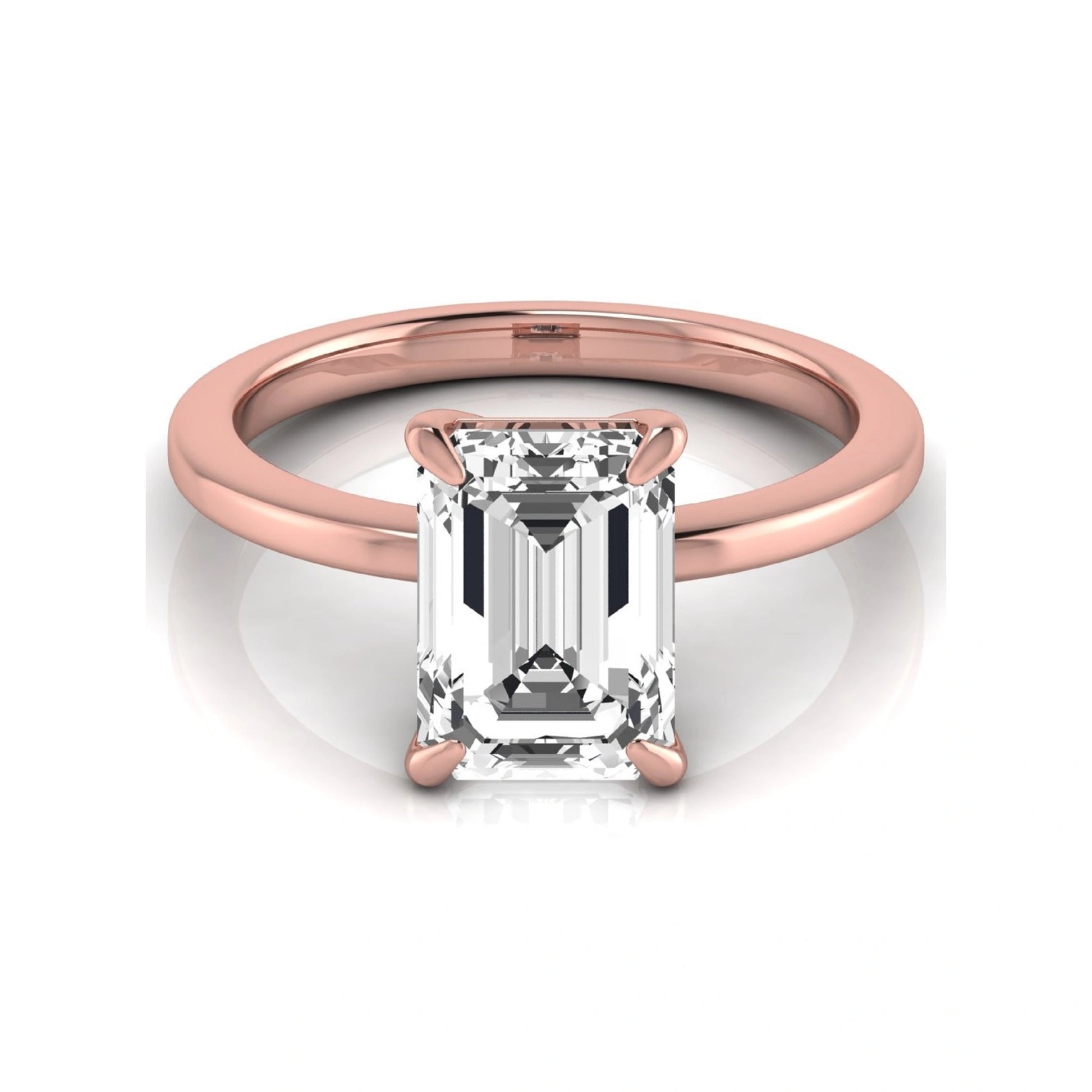 Emerald cut lab grown diamond solitaire engagement ring with a four prong setting in a rose gold tone, featuring an IGI certified 3.01 carat center diamond.