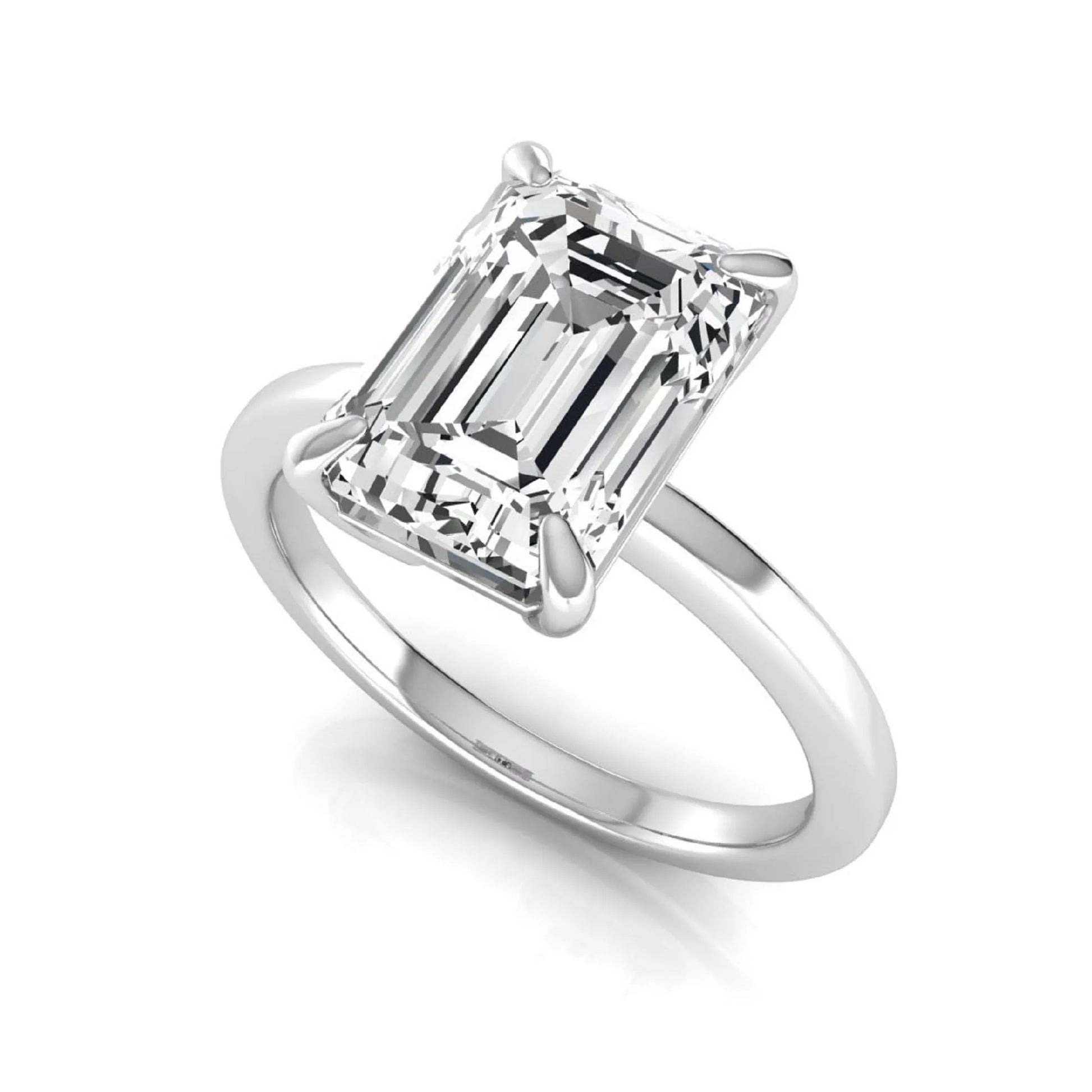 Emerald cut lab grown diamond solitaire engagement ring with a four prong setting in a white gold tone, featuring an IGI certified 3.01 carat center diamond.