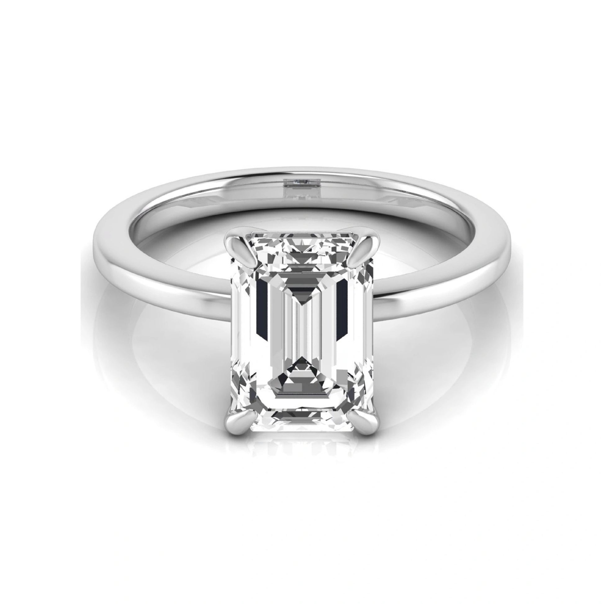 Emerald cut lab grown diamond solitaire engagement ring with a four prong setting in a white gold tone, featuring an IGI certified 3.01 carat center diamond.