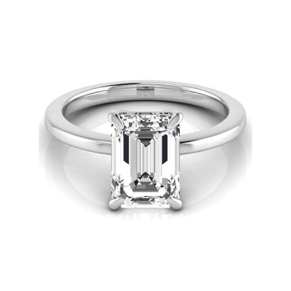Emerald cut lab grown diamond solitaire engagement ring with a four prong setting in a white gold tone, featuring an IGI certified 3.01 carat center diamond.