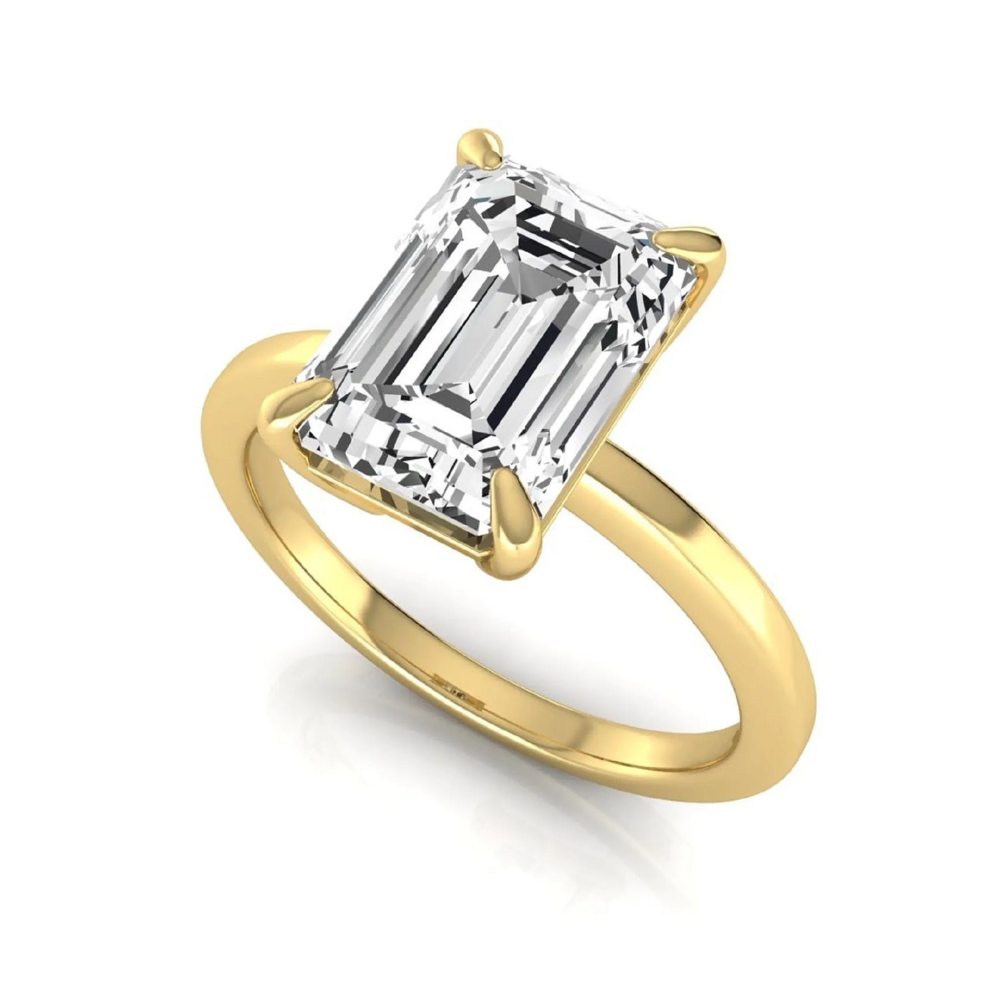 Emerald cut lab grown diamond solitaire engagement ring with a four prong setting in a yellow gold tone, featuring an IGI certified 3.01 carat center diamond.