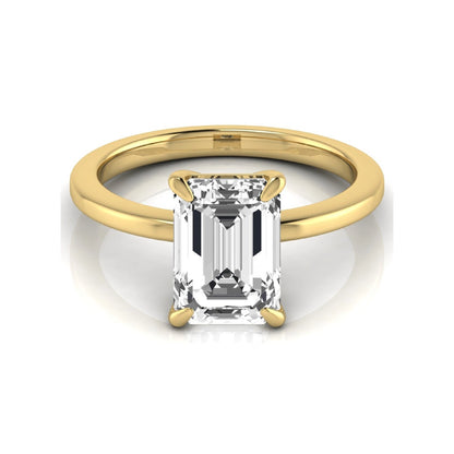 Emerald cut lab grown diamond solitaire engagement ring with a four prong setting in a yellow gold tone, featuring an IGI certified 3.01 carat center diamond.