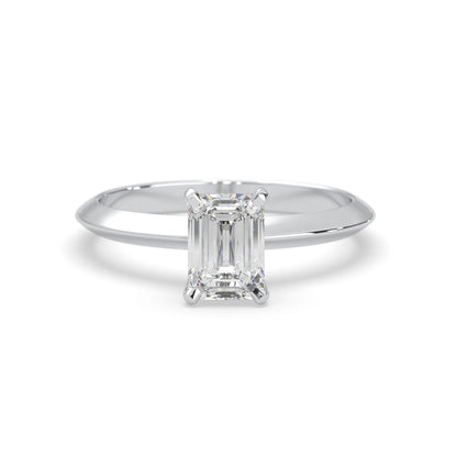white-gold Diamond ring with emerald-cut gemstone on a white background