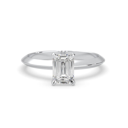 white-gold Diamond ring with emerald-cut gemstone on a white background