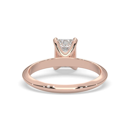 Rose-gold ring with a diamond on a white background