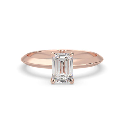 Rose-gold ring with a diamond on a white background