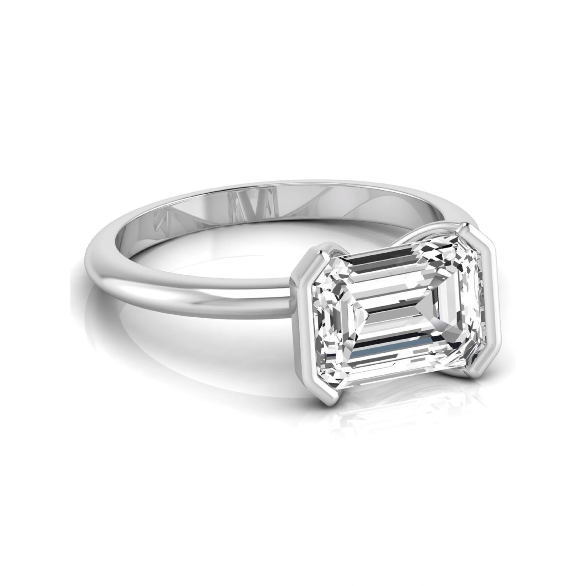 Emerald cut lab grown diamond engagement ring featuring a 5.00 carat center diamond in a modern half bezel solitaire setting with a polished white gold tone band.
