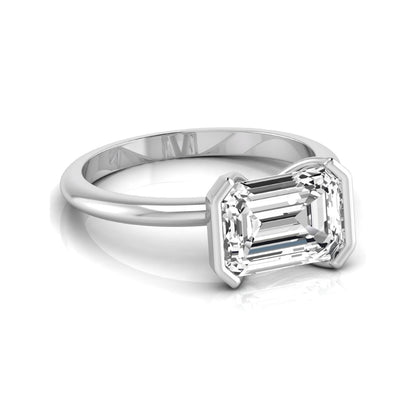 Emerald cut lab grown diamond engagement ring featuring a 5.00 carat center diamond in a modern half bezel solitaire setting with a polished white gold tone band.