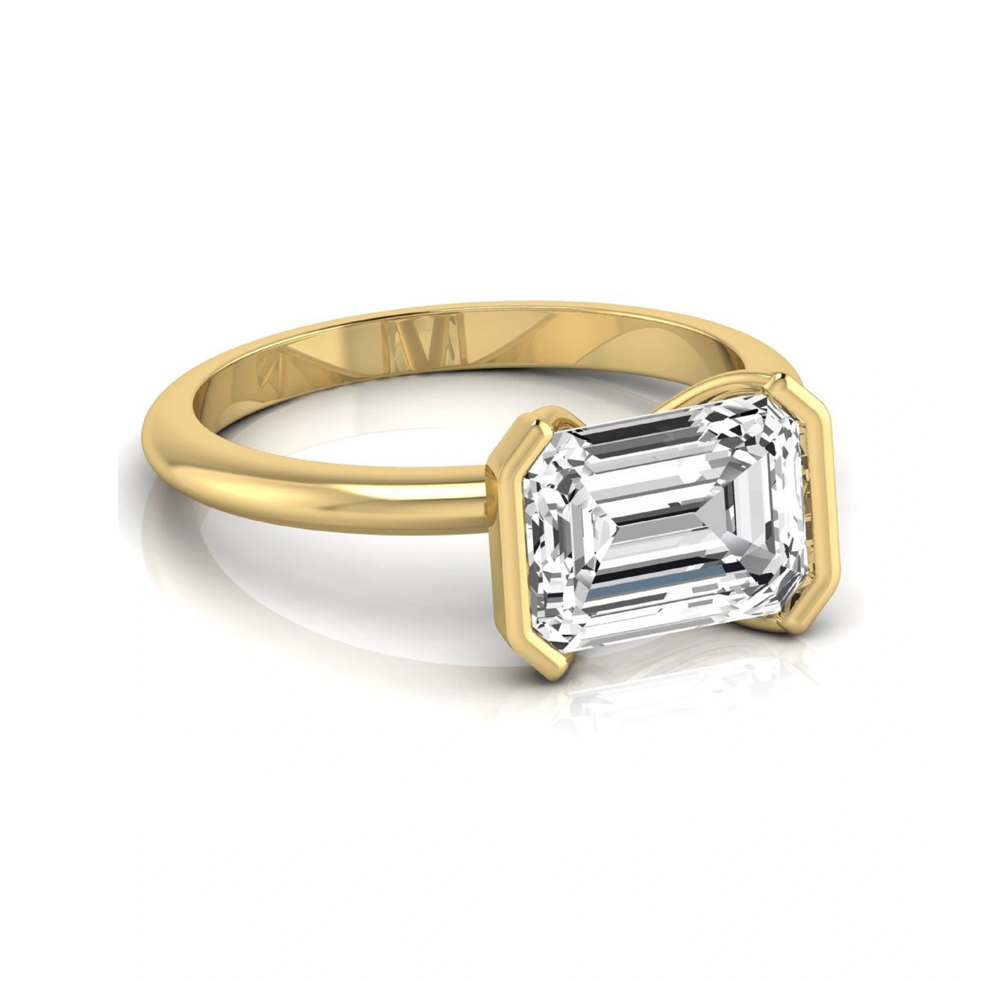 Emerald cut lab grown diamond engagement ring featuring a 5.00 carat center diamond in a modern half bezel solitaire setting with a polished yellow gold tone band.