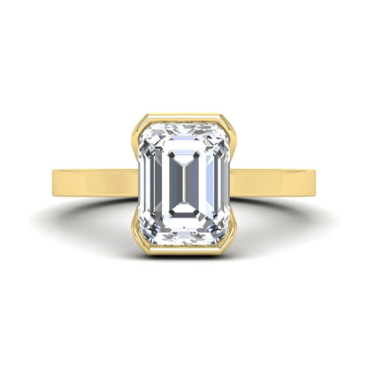 Emerald cut lab grown diamond half bezel solitaire engagement ring in yellow gold setting