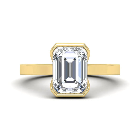 Emerald cut lab grown diamond half bezel solitaire engagement ring in yellow gold setting