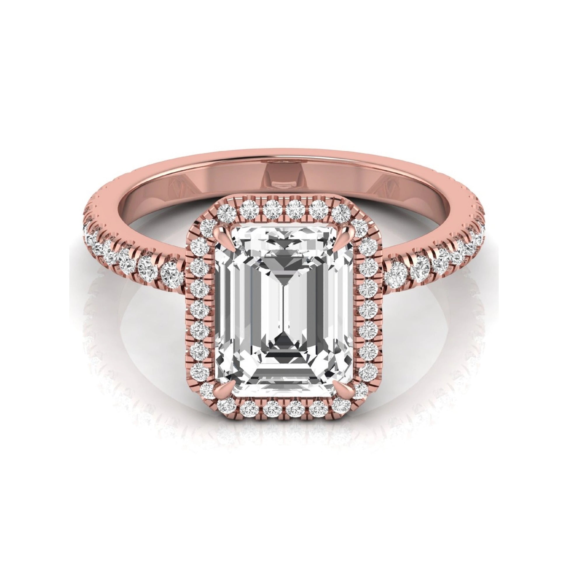 Emerald cut lab grown diamond engagement ring featuring a round diamond halo, pavé accent band, and four-prong setting with a polished rose gold tone band.