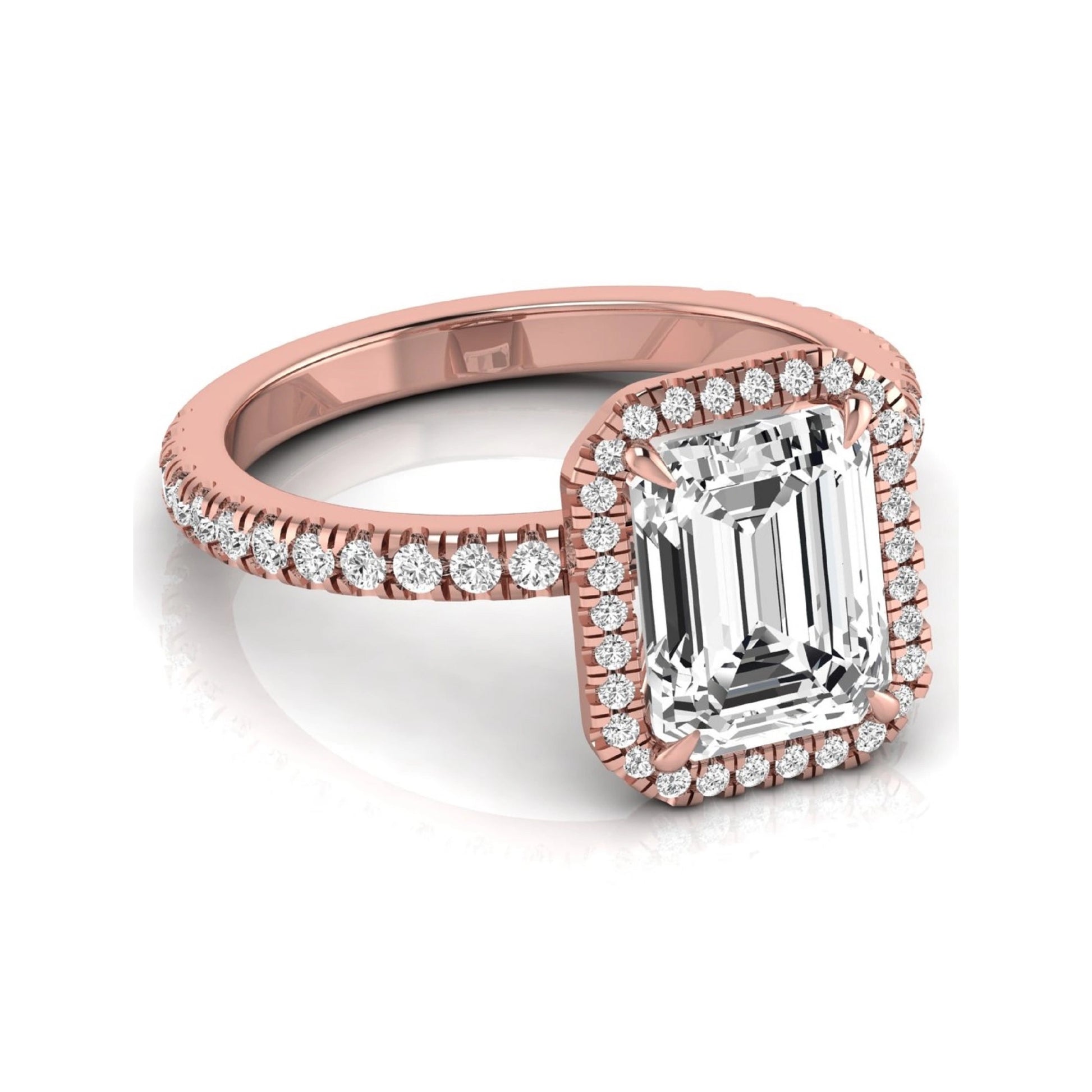 Emerald cut lab grown diamond engagement ring featuring a round diamond halo, pavé accent band, and four-prong setting with a polished rose gold tone band.