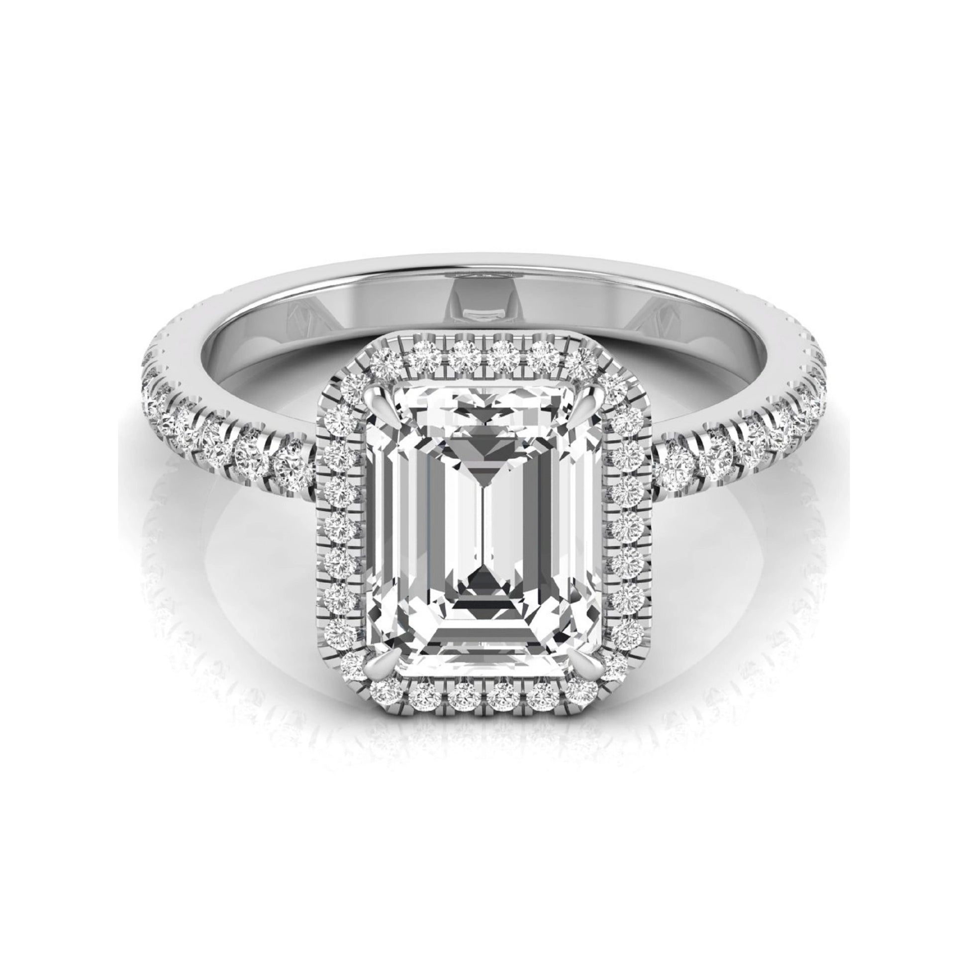 Emerald cut lab grown diamond engagement ring featuring a round diamond halo, pavé accent band, and four-prong setting with a polished white gold tone band.