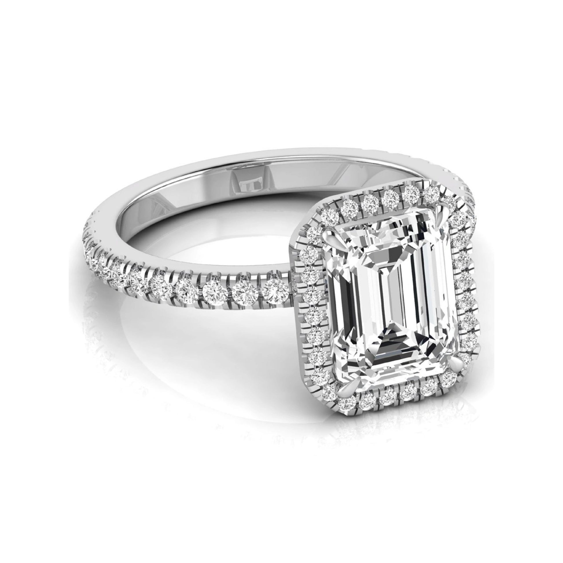 Emerald cut lab grown diamond engagement ring featuring a round diamond halo, pavé accent band, and four-prong setting with a polished white gold tone band.