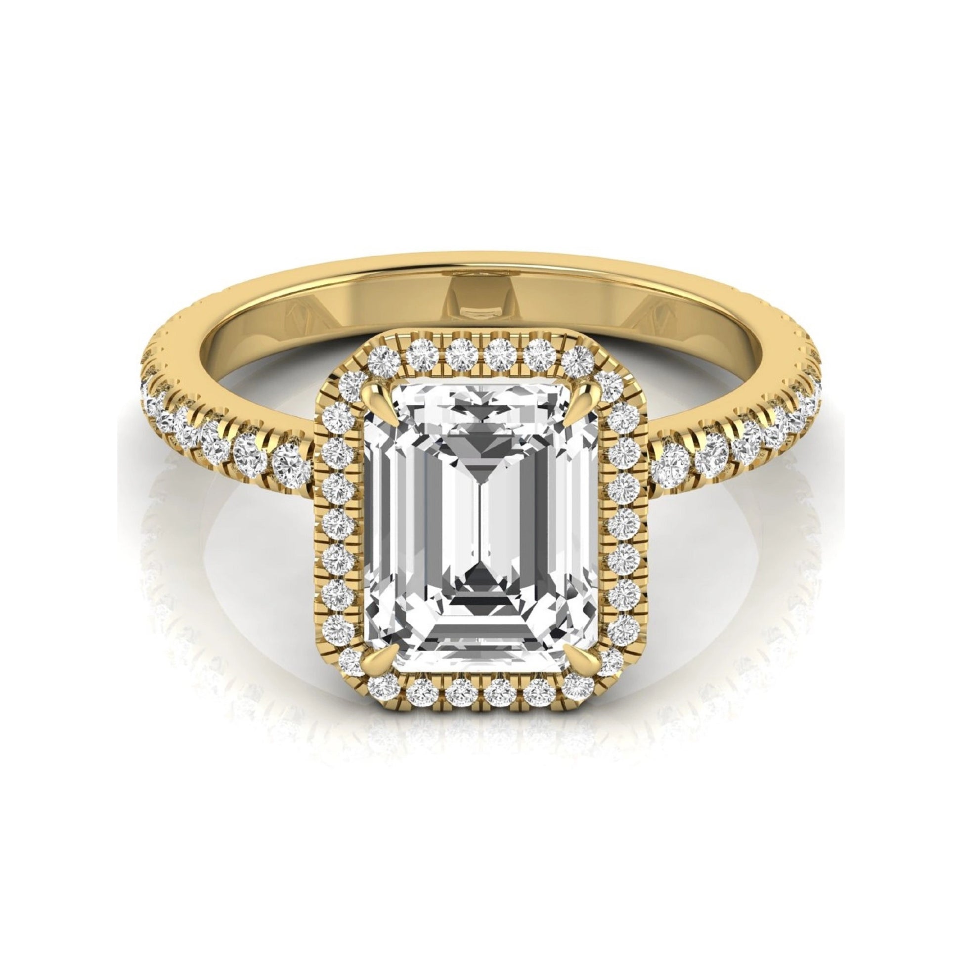 Emerald cut lab grown diamond engagement ring featuring a round diamond halo, pavé accent band, and four-prong setting with a polished yellow gold tone band.