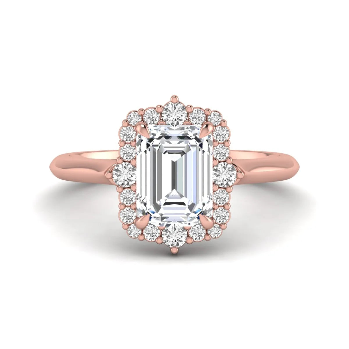 Emerald cut lab grown diamond halo engagement ring with round accent diamonds in a rose gold tone four-prong setting.
