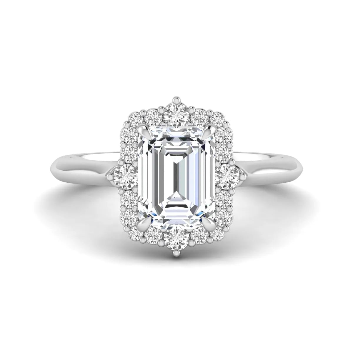 Emerald cut lab grown diamond halo engagement ring with round accent diamonds in a white gold tone four-prong setting.
