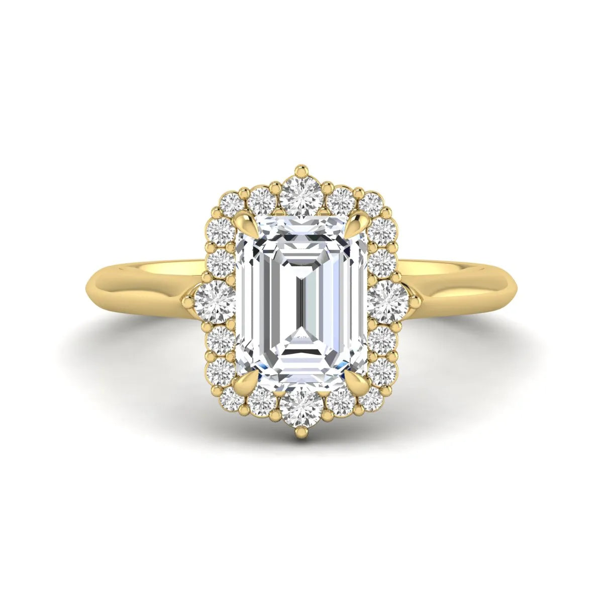 Emerald cut lab grown diamond halo engagement ring with round accent diamonds in a yellow gold tone four-prong setting.