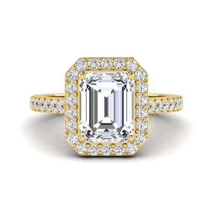 IGI Certified 2.75 carat emerald cut lab grown diamond halo engagement ring with pavé diamond band in yellow gold.